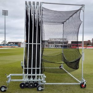 Collapsible steel cricket batting cage with black netting, shown partially folded on a stadium ground, manufactured by Batting Cages Australia.